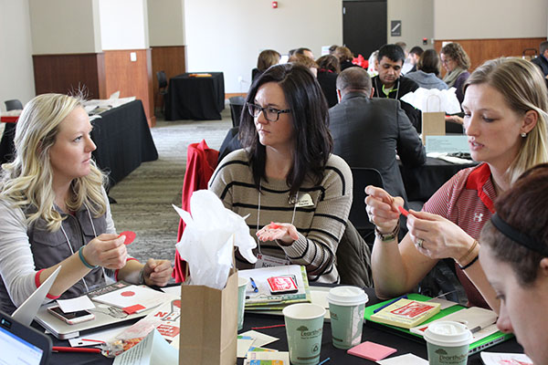 Kristen Slechta of ESU 9 (center) discusses the fortune-telling fish activity with other Summit attendees on Dec. 12, 2016. LINDSAY AUGUSTYN/UNL CSMCE