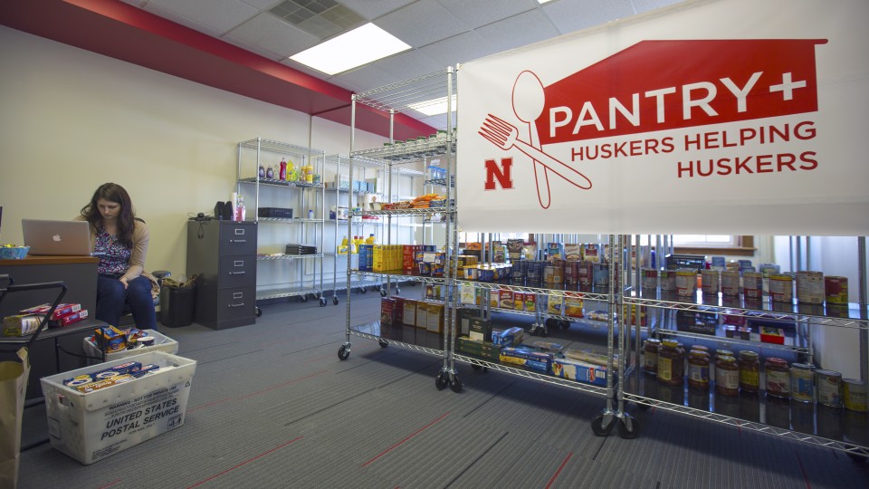 Jessica Lanctot, a graduate assistant, prepares items in the Huskers Helping Huskers Pantry+ on Jan. 6. The pantry, which will offer food, other necessities, housing assistance and financial counseling to students, opens Jan. 9 in the Nebraska Union. |  T