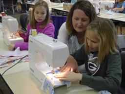 Many youth learned beginning sewing skills at last year's 4-H "Pillow Party" sewing workshop.