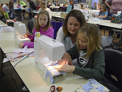 Many youth learned beginning sewing skills at the 2016 4-H "Pillow Party" sewing workshop.