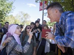 Kevin Pulver, right, from the Consuming Fire Fellowship, argues his religious beliefs with Zahraa Albusharif, a Muslim from Iraq, on Sept. 11, 2015, outside the Student Union at the University of Nebraska-Lincoln.