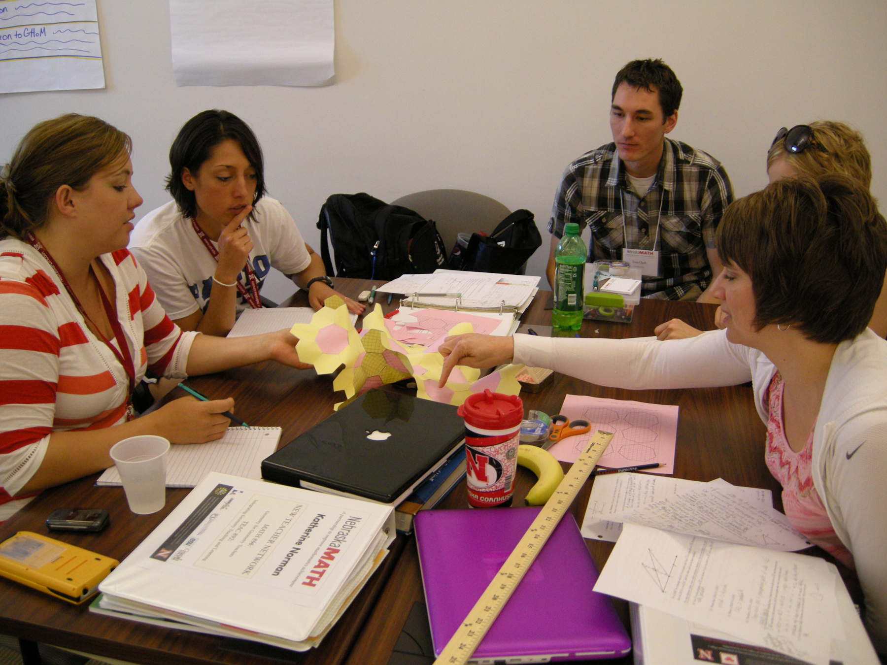 Tom Clark (back, right) helps teachers during New Teacher Network in 2011.
