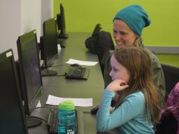 Mentor Gretchen Larsen helping LPS student, Brynn, develop her coding skills during the first CADDY workshop.