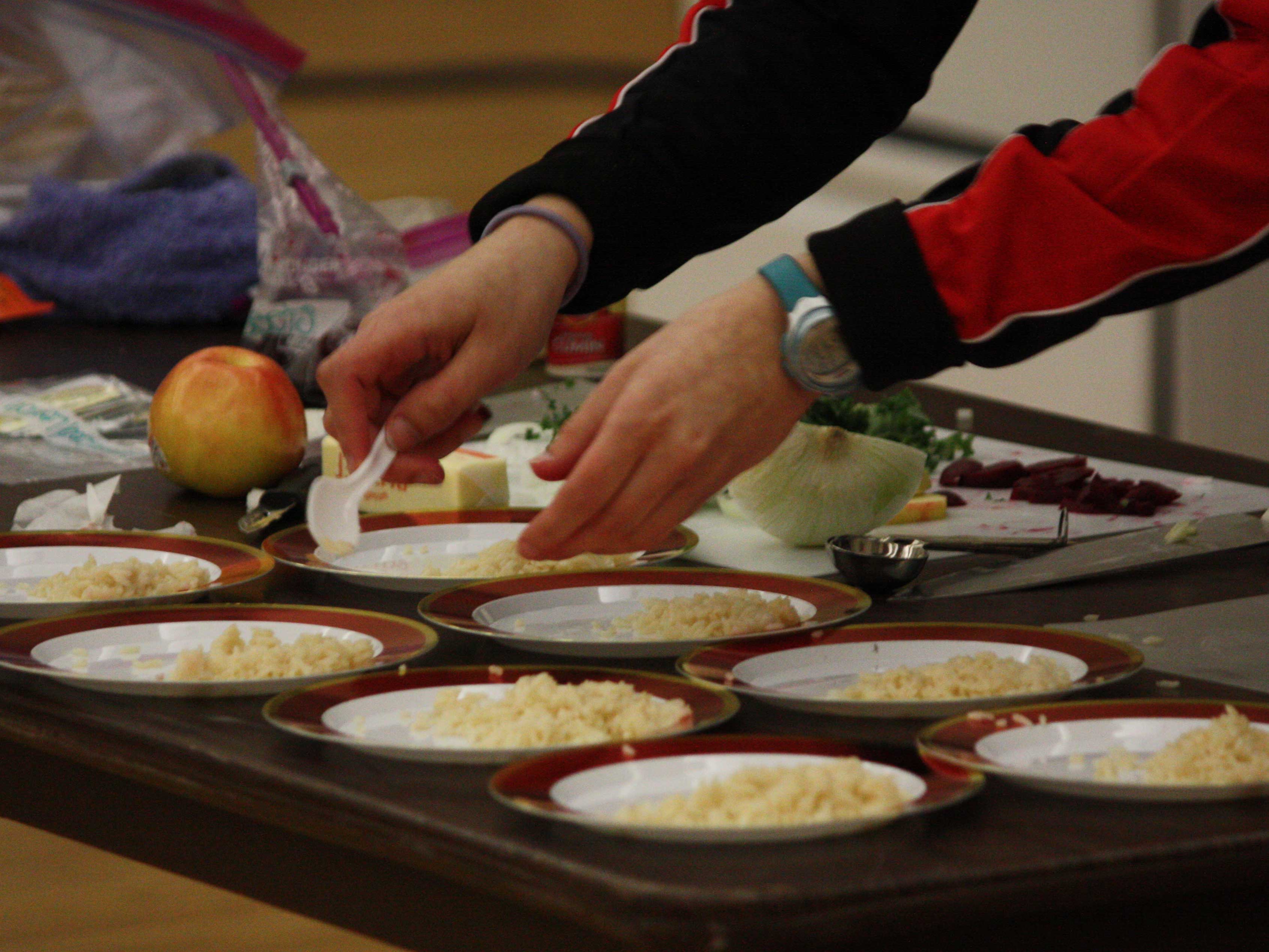 Teams were provided specific ingredients to create their creative culinary masterpieces.
