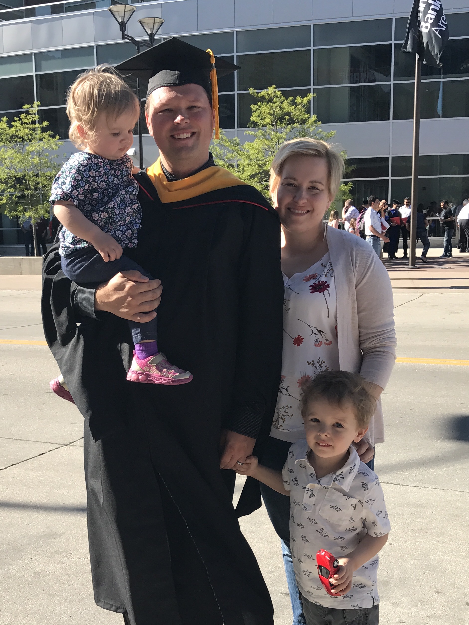 Brad Goetsch with Sara (spouse), Lily, and Logan at UNL's Graduation Ceremony for the Graduate College.