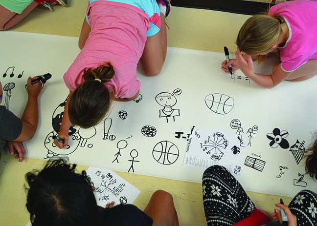Students from Culler Middle School's Community Learning Center draw symbols as part of the "Me+We" Summer Design Workshop. Courtesy photo.