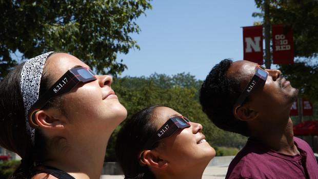 Students look at the sun using specialized glasses. The university will provide the glasses to students for the Aug. 21 total solar eclipse.