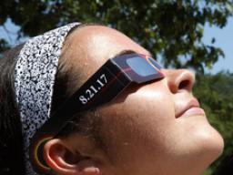 Students look at the sun using specialized glasses. The university will provide the glasses to students for the Aug. 21 total solar eclipse.