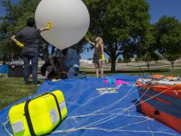 Nebraska's Michael Sibbernsen and students from Metropolitan Community College prepare a high-altitude balloon for launch on June 24. The launch was a test run for a NASA-funded project for the solar eclipse on Aug. 21. 
