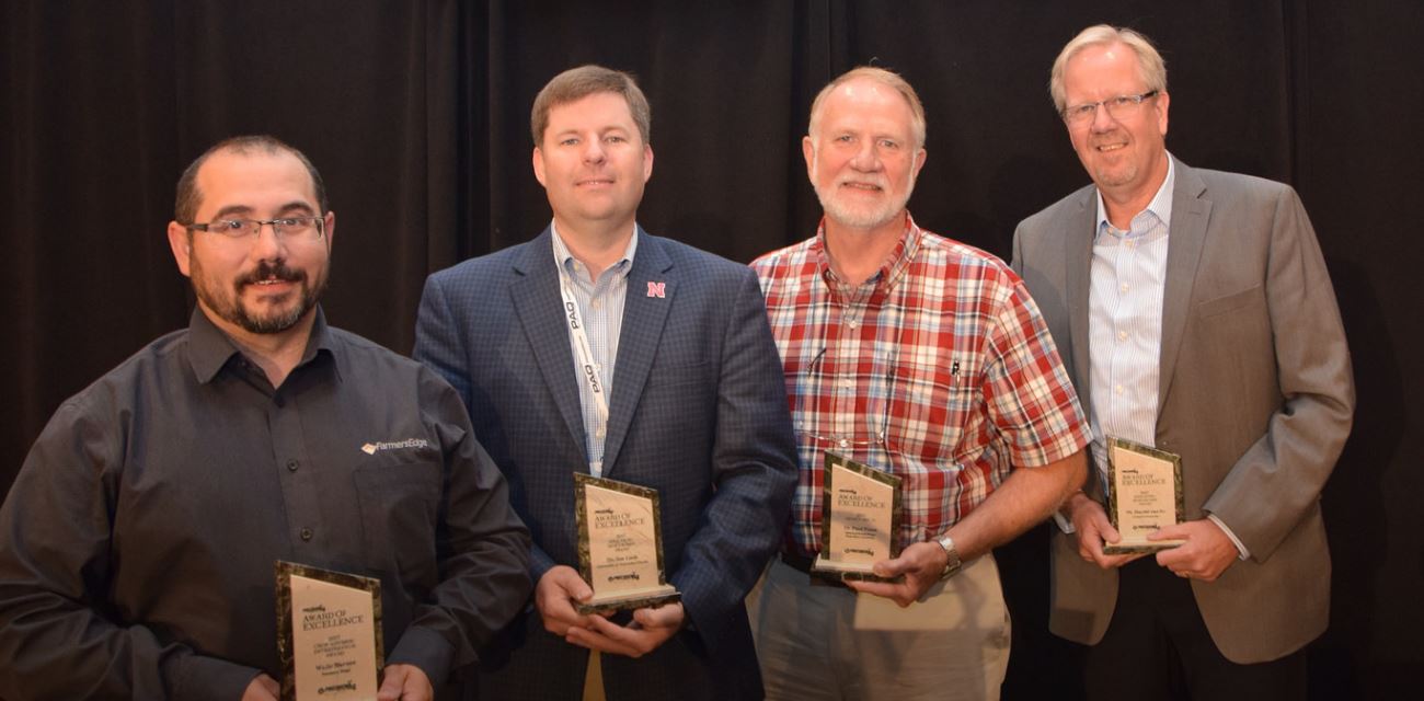 Luck, second from left, received one of four Awards of Excellence from the PrecisionAg Institute at its July conference. Photo courtesy of ZimmComm New Media.