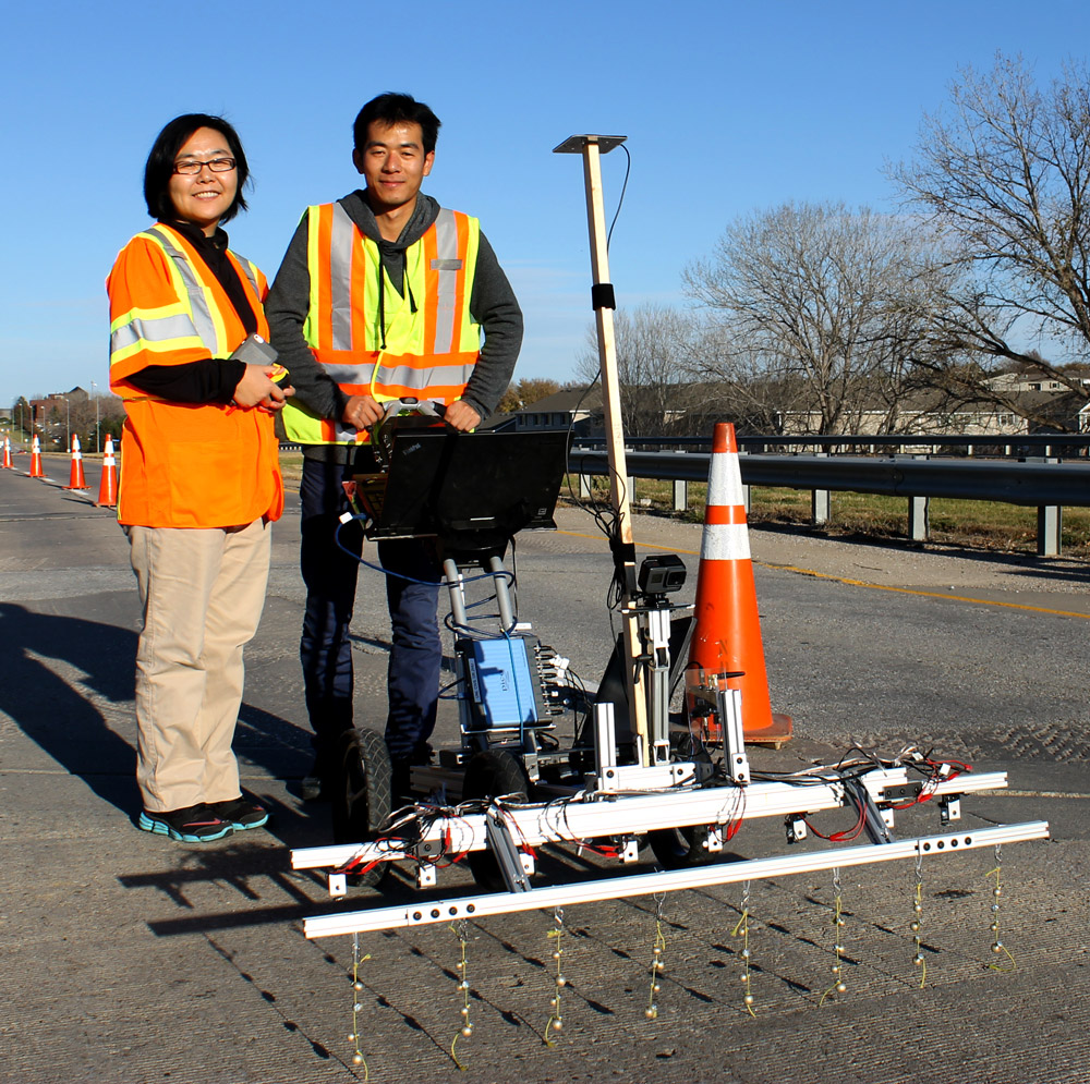 Dr. Zhu and Hongbin Sun with the acoustic detection cart.