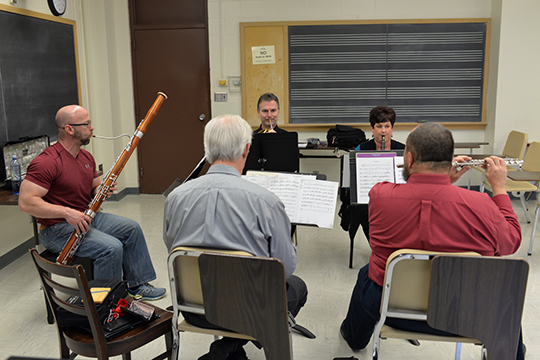 The Moran Woodwind Quintet rehearse for their Nov. 15 concert, which features the premiere of Scott McAllister's "OK Quintet." Photo by Michael Reinmiller.
