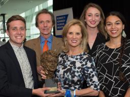 Depth Reporting students, along with professors Joe Starita and Rebekka Herrera, receive the Robert F. Kennedy Human Rights Journalism grand prize from Ethel Kennedy. 