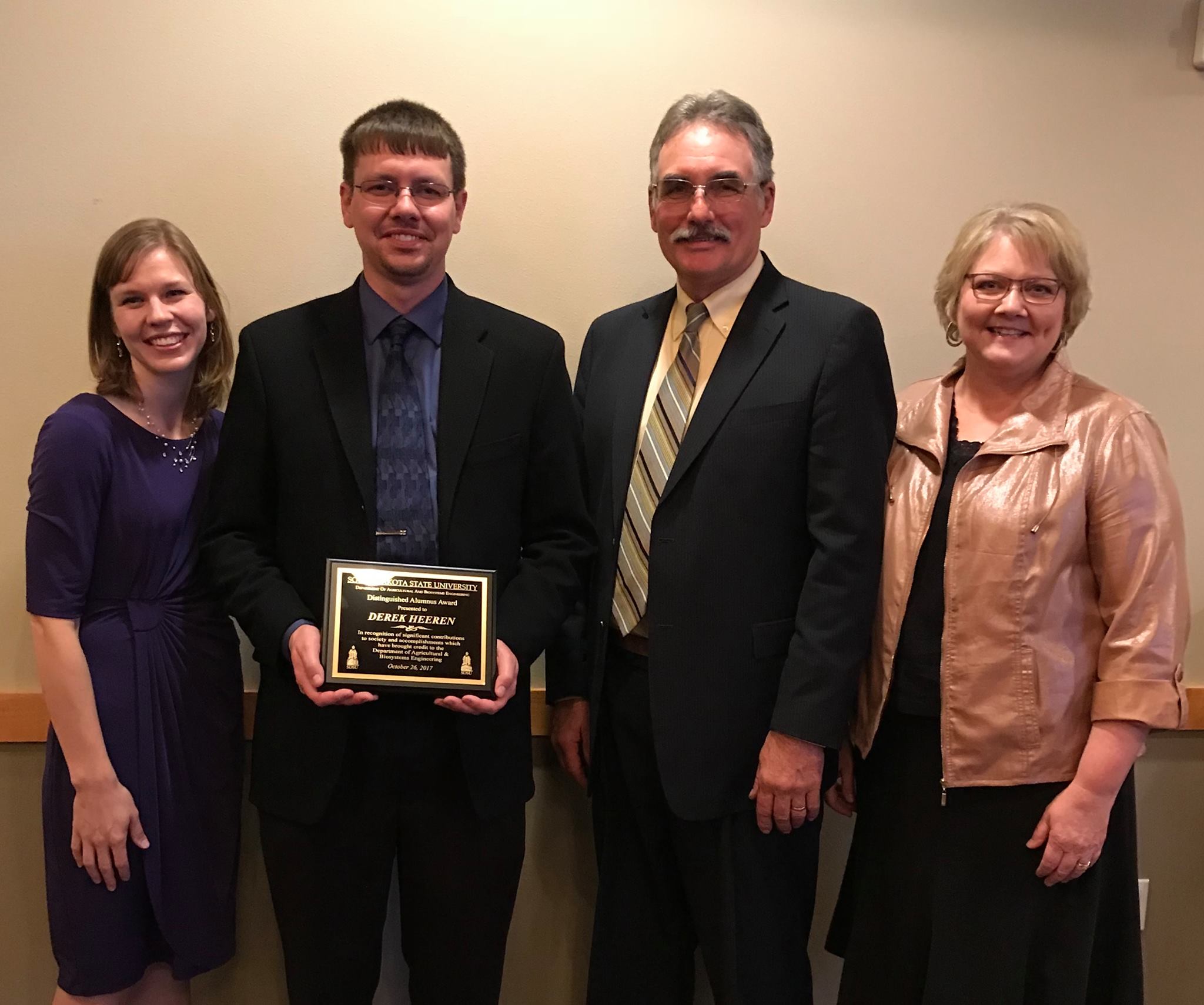 Derek Heeren's wife, Amber, and parents, Don and Carol Heeren, were on hand as he received an alumnas award at SDSU’s 2017 Banquet of Excellence.