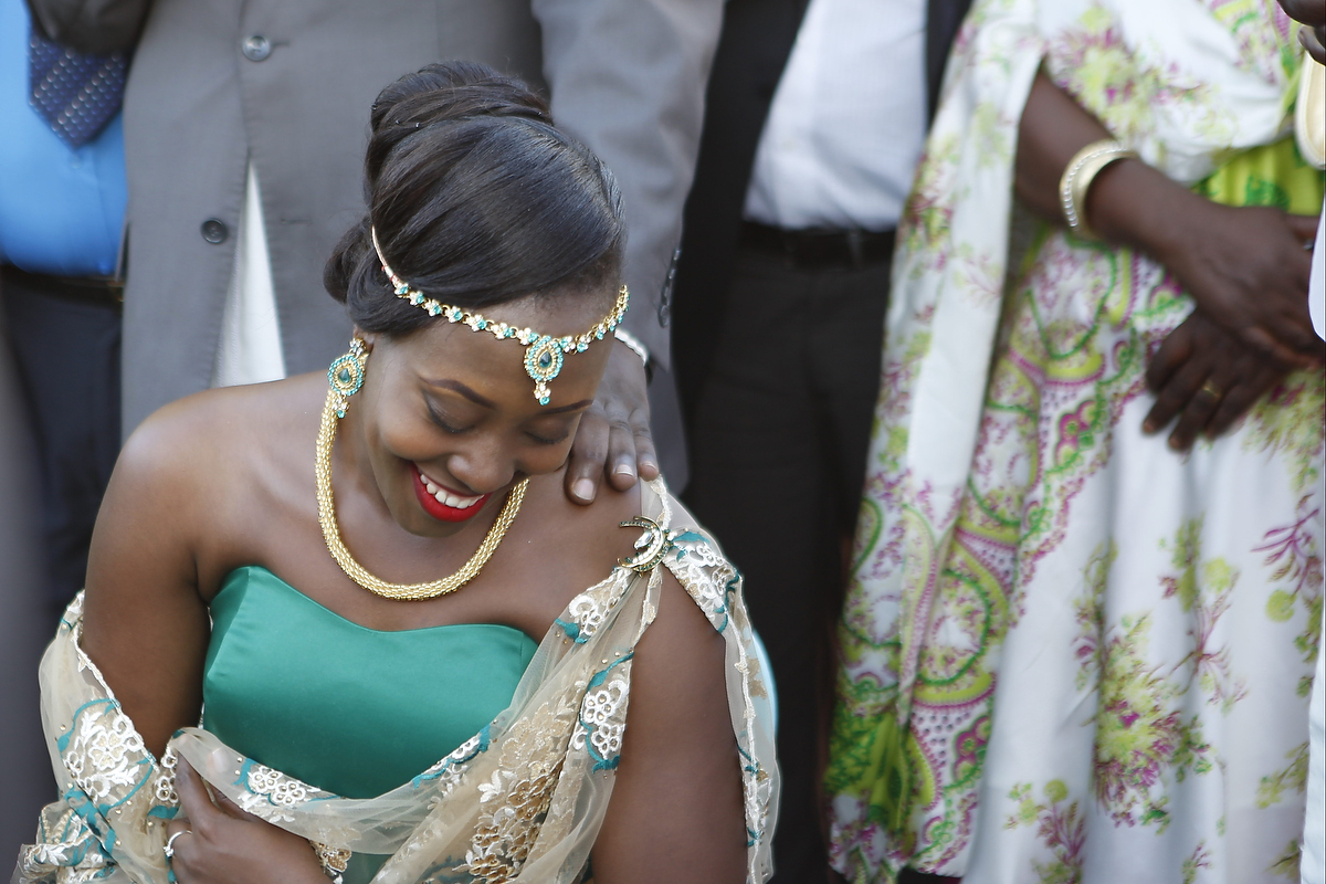 Bride Isabella Katwesigye smiles while listening to her family speak during her traditional wedding ceremony. In addition to covering this story, Tess Williams had various opportunities to immerse herself in the rich culture of Uganda. Photo by// Tess Wil