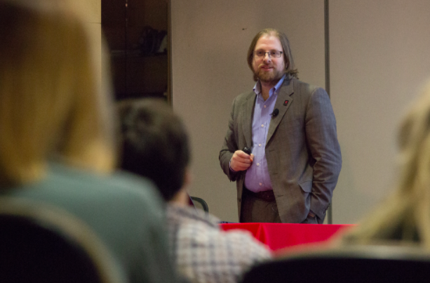 Gus Hurwitz,  assistant professor and co-director of the Space, Cyber & Telecom Law Program at the UNL College of Law, discusses the different between public and private information. (Photo by Emily Case). 