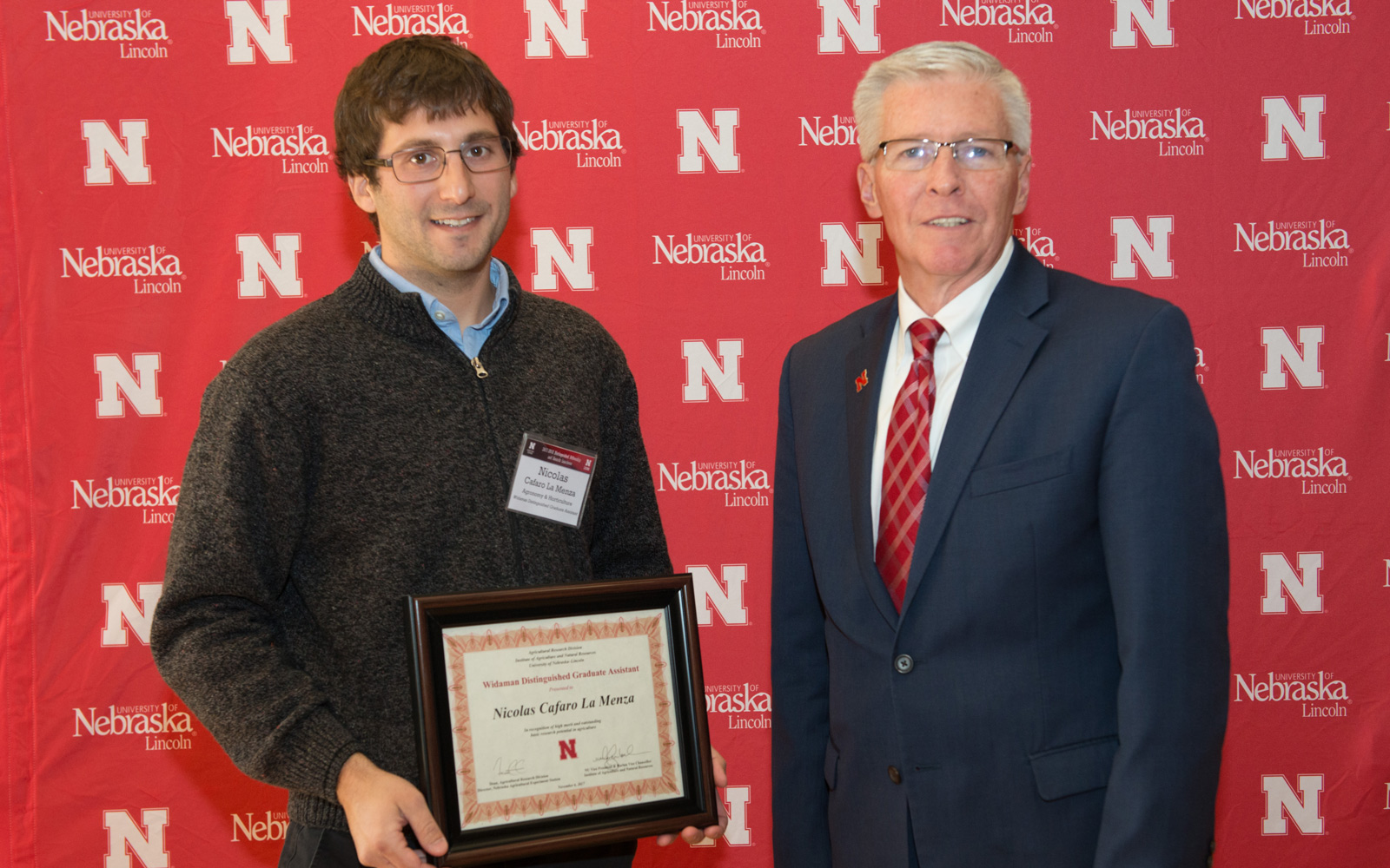 Nicolas Cafaro la Menza receives the Widaman Distinguished Graduate Assistant Award from Archie Clutter, ARD Dean.  Greg Nathan | University Communication