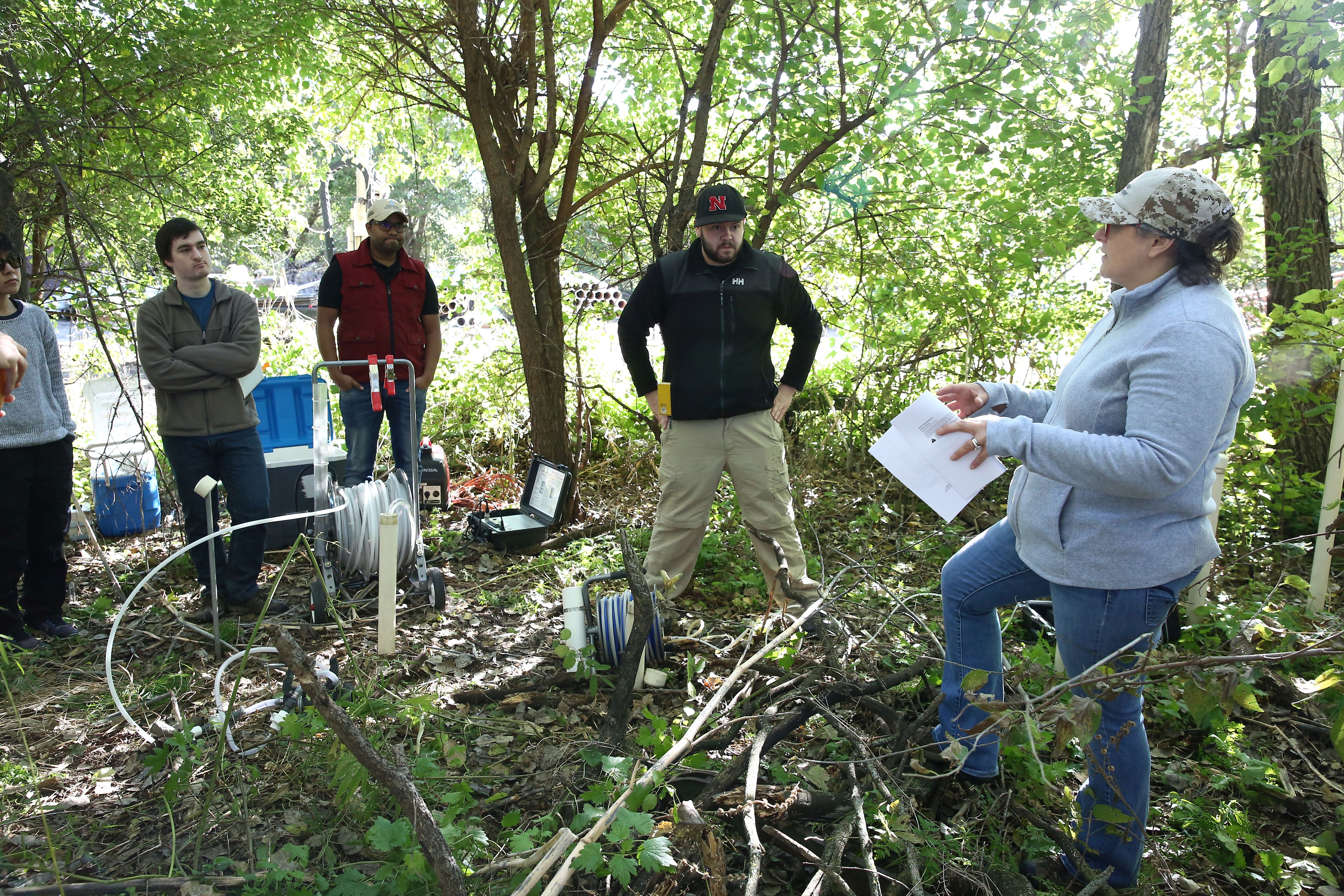 DWFI Faculty Fellow Karrie Weber (right), associate professor of biological sciences and earth and atmospheric sciences, provides direction to students as they prepare to test uranium levels in groundwater near Alda, Nebraska.