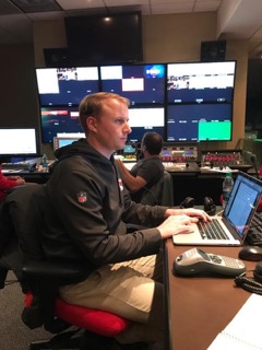 Kevin Brebner, director of production for the Kansas City Chiefs, works in the control room directing the postgame show.