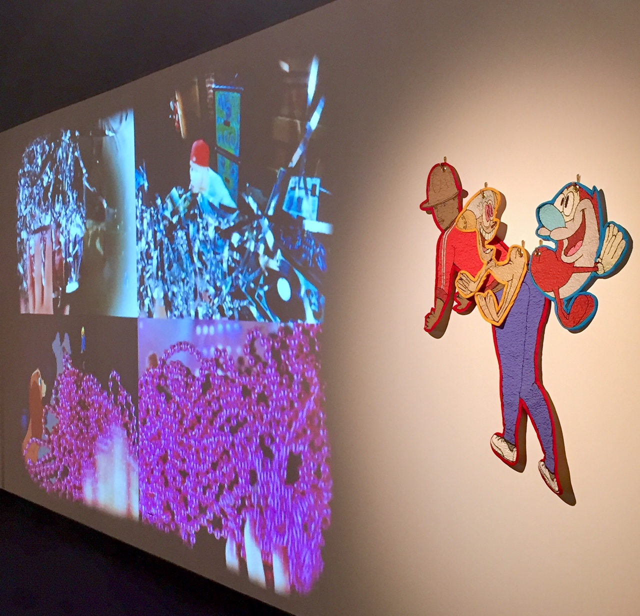 Installation View.  Video (right) and "Happy, Happy Joy Joy -- Pharrell Williams" (left).  Digitally printed and quilted cotton.  2017.