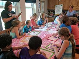 Pictured are Fusion 4-H’ers club members working on a project during a club meeting, which members then exhibited at the Lancaster County Super Fair.