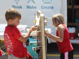 Elementary and middle school students participate in activities offered at the Think Make Create Lab during the 2017 Nebraska State Fair in Grand Island. The mobile maker spaces are funded by Beyond School Bells, which is partnering with Nebraska Innovati