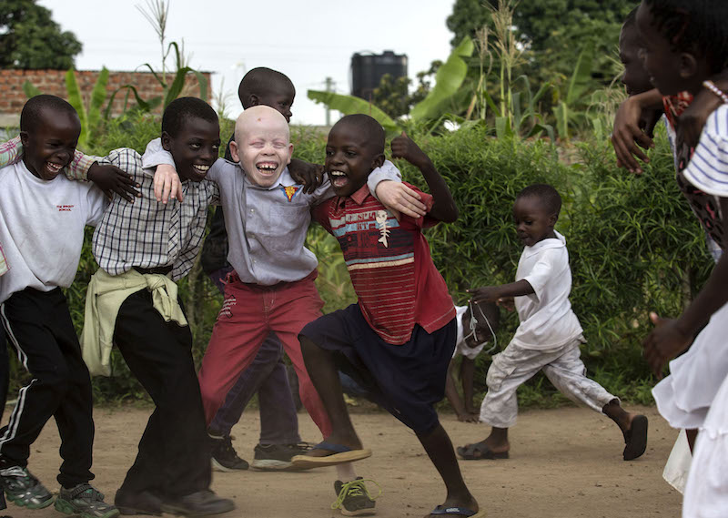 Benny Hinn, 10, plays with his friends outside a church in Nakifuma, Uganda.