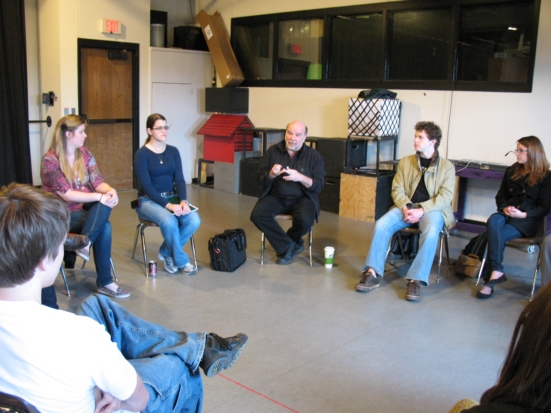 Steve Shelley (center) visits with students in a lighting design class on April 4.