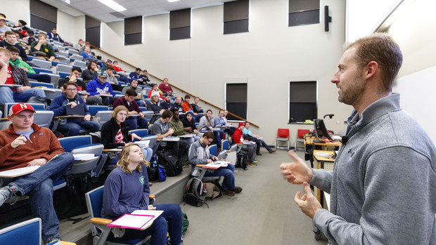 Olympic medalist Curt Tomasevicz teaches an engineering economics lesson in Brace Hall.