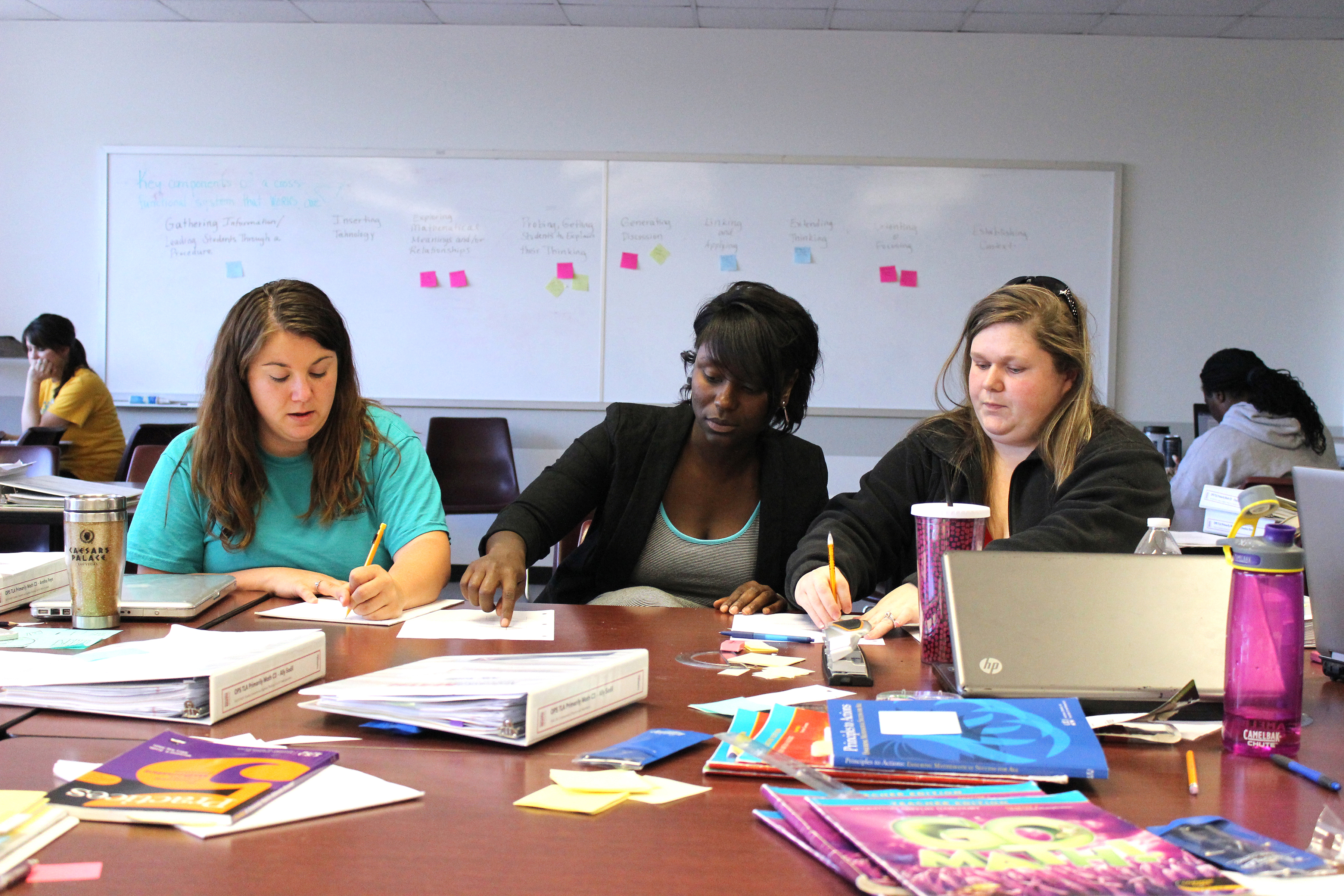 Noyce Master Teaching Fellow Kesha King (center), an elementary teacher, co-teaches Primarily Math.