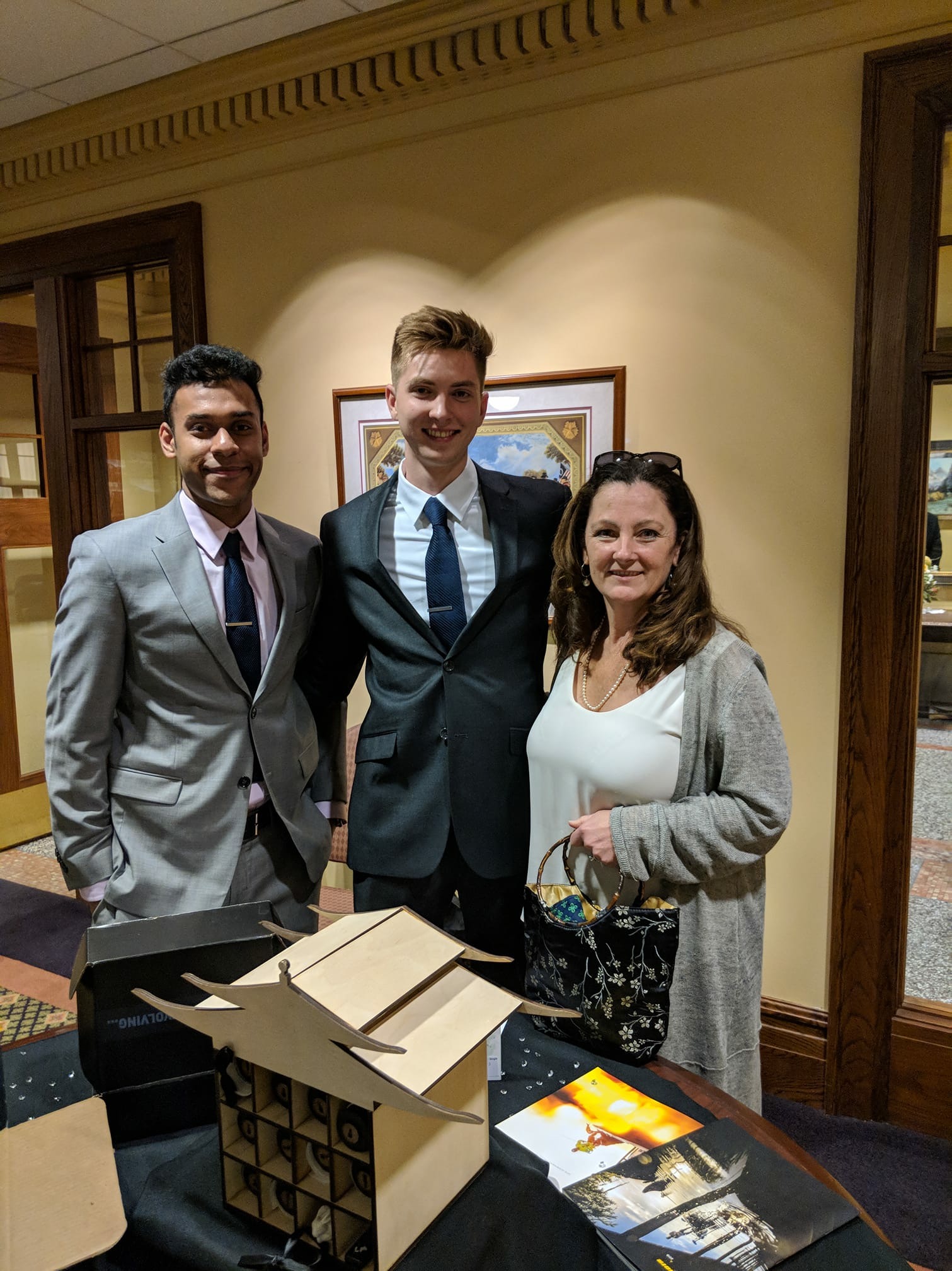 Addy Winners Faraz Mohd and Logan McIntyre with Assistant Professor Colleen Syron at AAF's awards ceremony. 