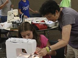 A 4-H sewing help session in 2017.