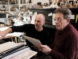 Paul Barnes (left) and Philip Glass review the score for "Annunciation." Photo by Peter Barnes.