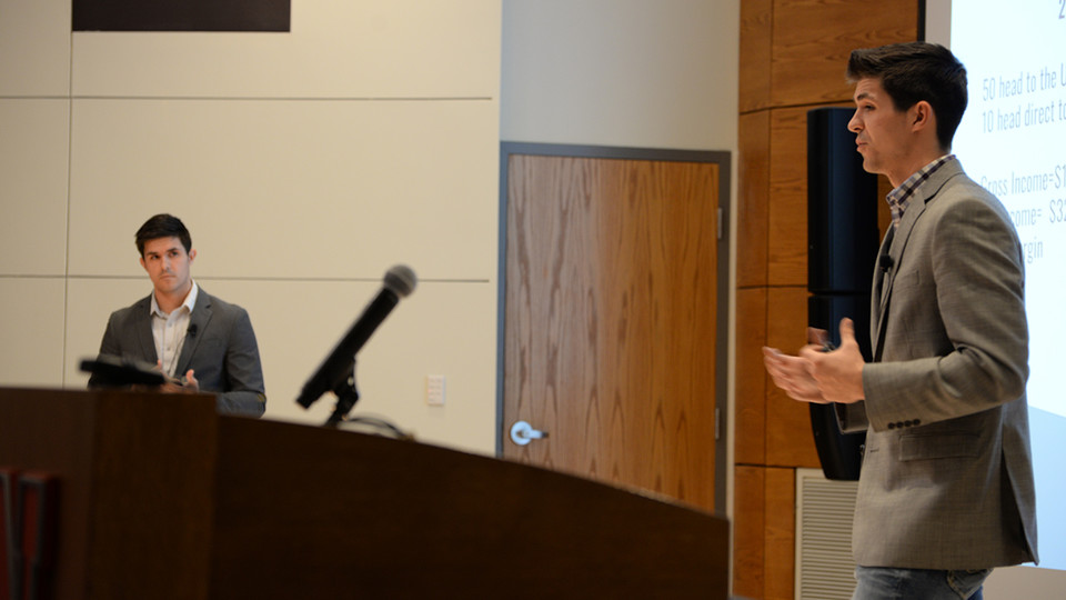 Joseph Brugger (left) and Matthew Brugger (right) pitch their company, Upstream Farms, to judges during the final round of the New Venture Competition. The brothers were co-champions of the competition and won $25,000.