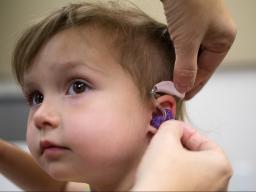 Evie Rausch is one of the 390 children who has received hearing aids through HearU Nebraska.