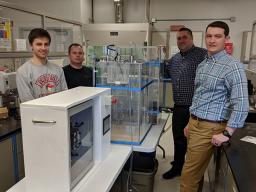 As a unique collaboration between civil engineering and electrical and computer engineering departments - students John Strudl (left), Derek Nelsen (second from left), Jacob Eckstrom (right) and Isaac Knutson (not pictured) and senior design instructor Ge