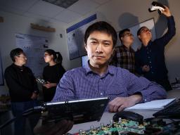 Sheng Wei (center), assistant professor of computer science and engineering at Nebraska, has earned a Faculty Early Career Development Program award from the National Science Foundation to advance his work in computer hardware security and trust. Behind W