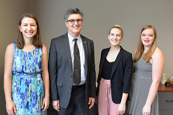 Left to right: Krista Benesch, Dean Chuck O’Connor, Emily Gauger and Haley Collins.