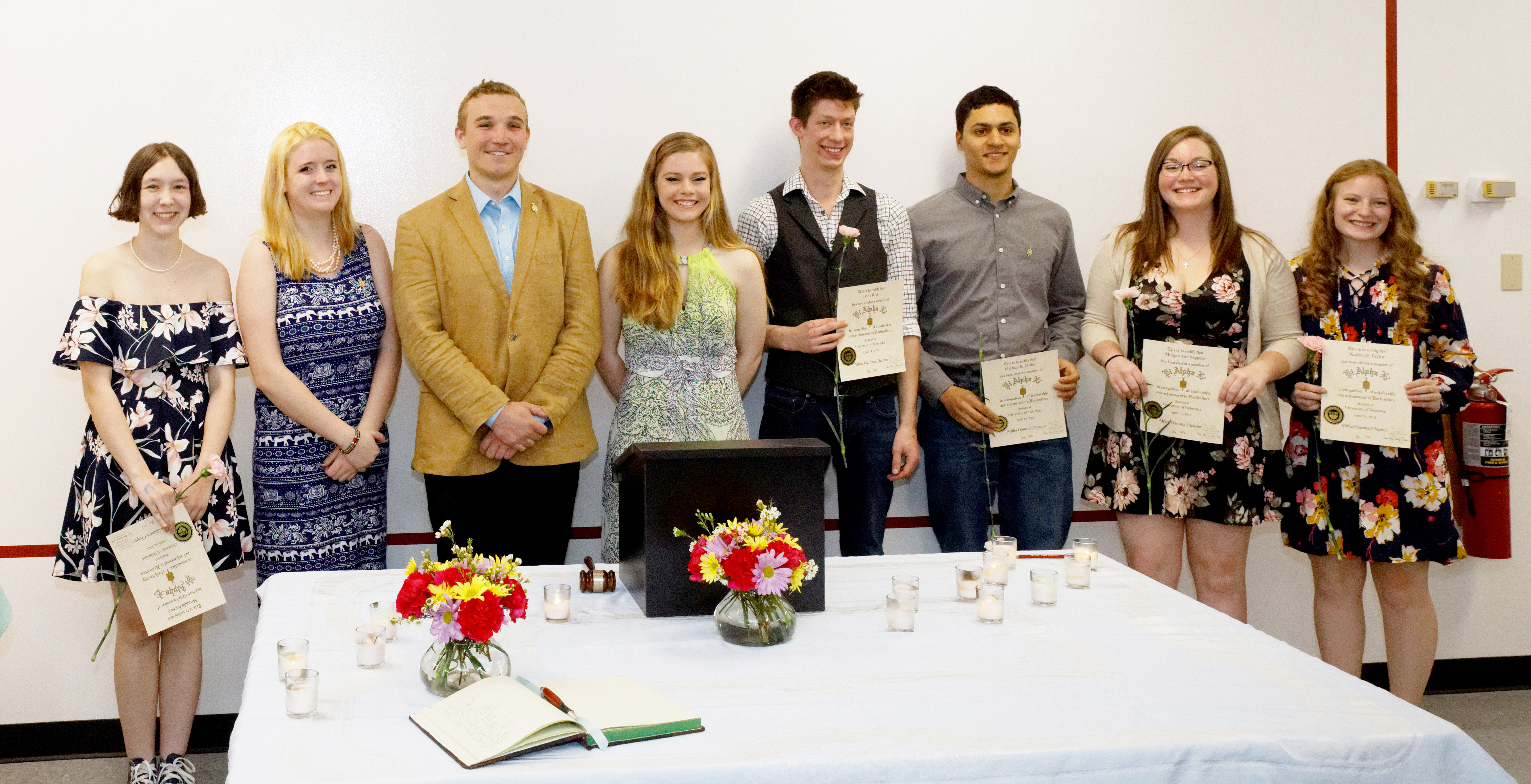 Amanda Earnest (from left), Zoe Gildersleeve, Ben Searl, Olivia Fiala, Jason Ries, Michael Miller, Morgan Von Seggern and Kaitlin Taylor are inducted into Pi Alpha Xi. Not pictured is Alexander Monette.  |  Courtesy Luqi Li