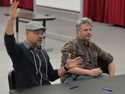 Nathan Tysen (left) and Chris Miller meet with students in the Glenn Korff School of Music. Photo by Michael Reinmiller.