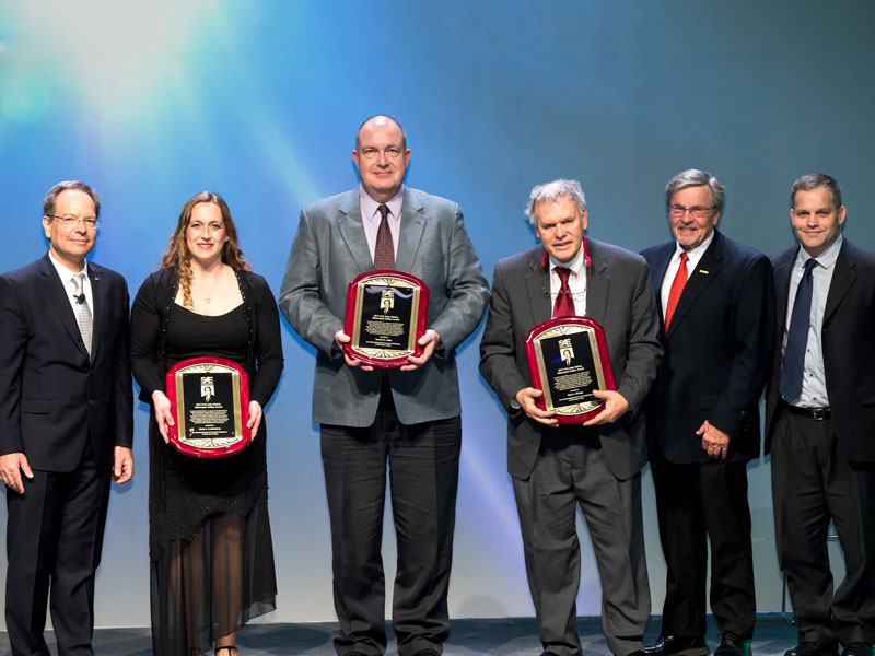 Members of SAE International present the John Melvin Motorsports Safety Award to Karla Lechtenberg, Ron Faller and Dean Sicking