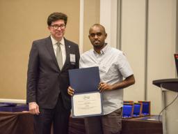 Binyam Bekele accepting his award. He competed with top contenders from prestigious schools worldwide, including Ohio State University, Columbia University, Harbin Institute of Technology, University of Maryland, Clemson University, University of Californ
