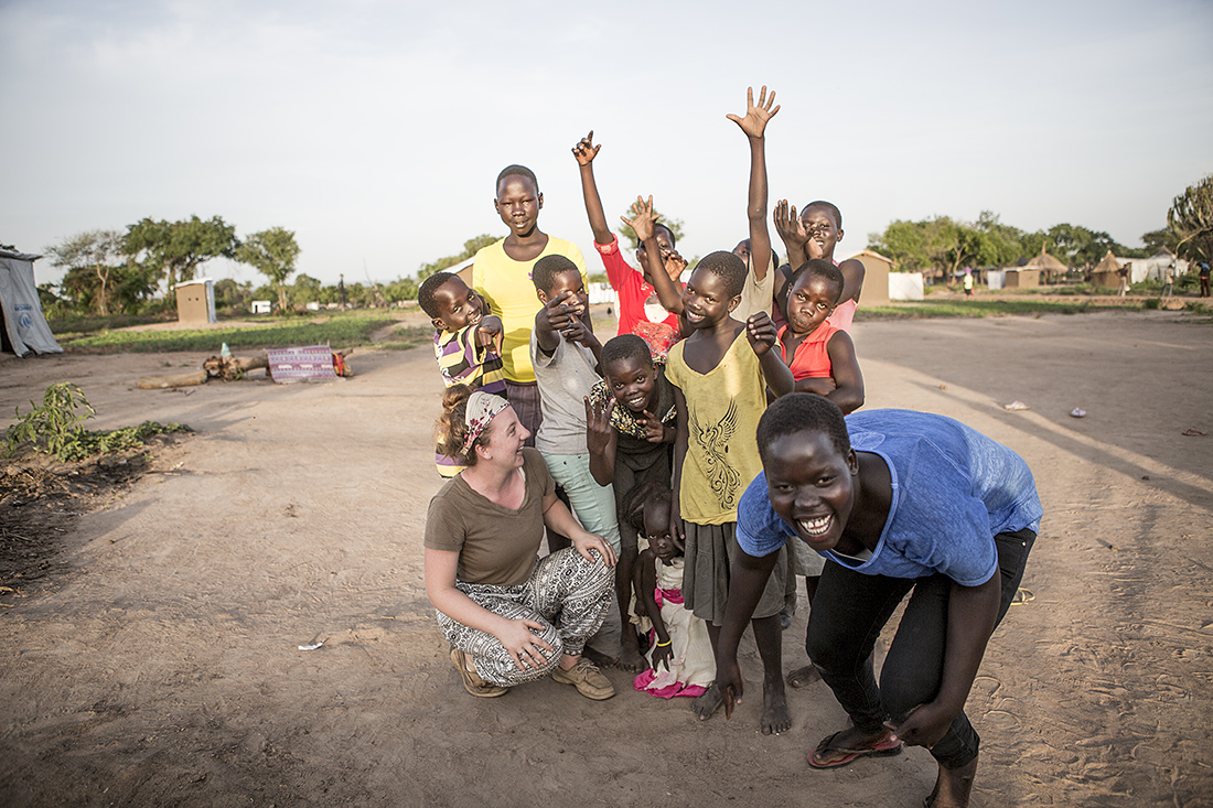 Cahner Olson poses with a group of refugee children from St. Bartholomew's Orphanage in Uganda.