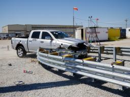 A truck crashes into a bull-nose barrier being tested for use in medians to protect cars from overpass columns. (University Communication photo)