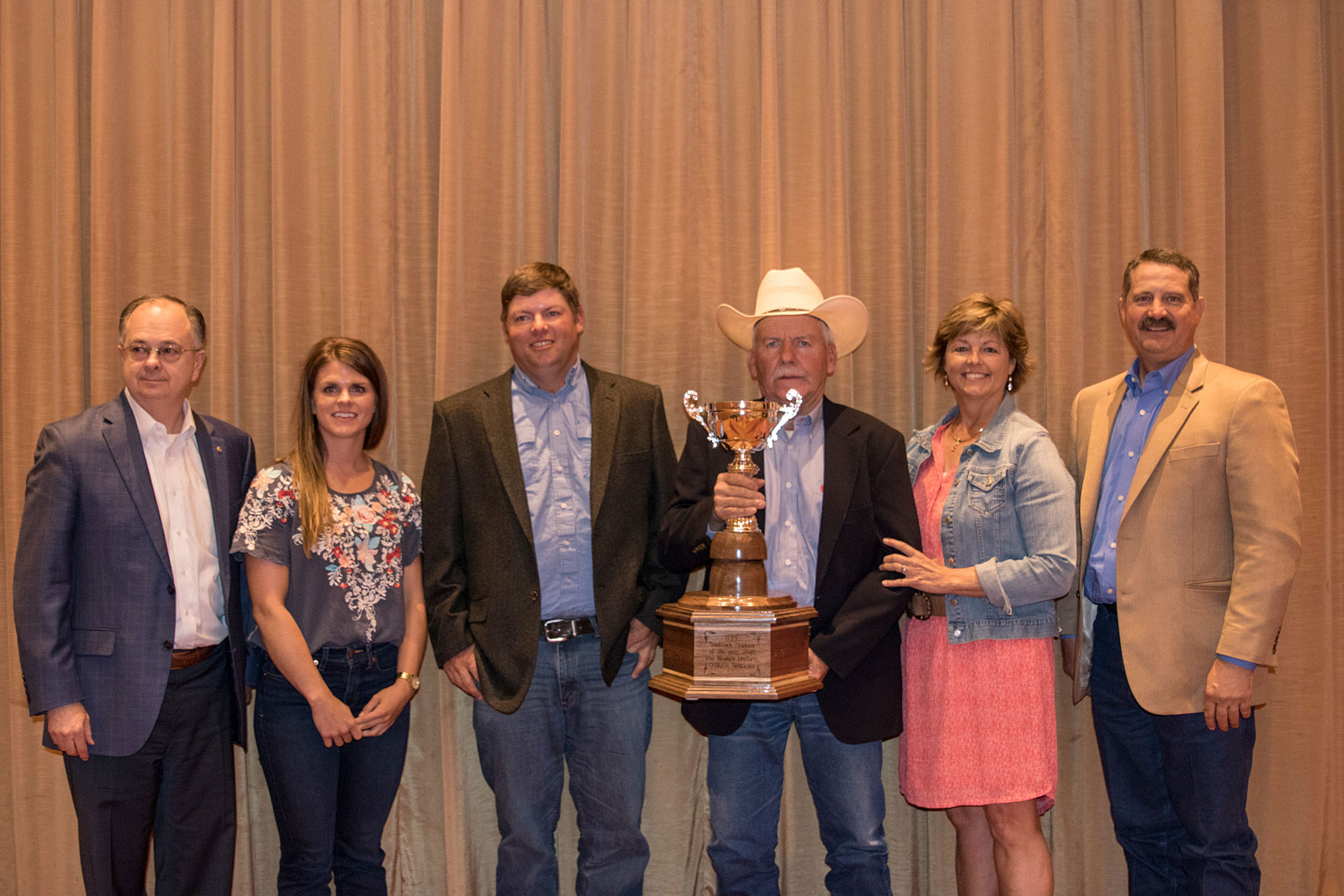 Van Newkirk, Oshkosh, NE, was named the 2018 BIF Seedstock Producer of the Year. Pictured are Steve May, BEEF magazine, award sponsor; Sara, Kolby, Joe and Cyndi Van Newkirk; and Donnell Brown, 2017-2018 BIF president.  Photo courtesy of Angie Denton.
