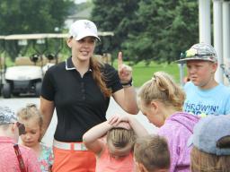 Briana Werner explains the day's activities to campers at a golf camp June 28.