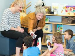 From right, Gwen Nugent, CYFS research professor, and Kathleen Rudasill, professor of educational psychology and associate dean for research and faculty development at Virginia Commonwealth University, introduce children to a few of the puppet characters 