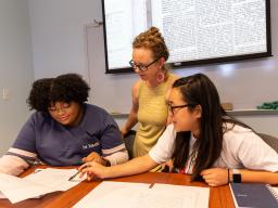 Dr. Katrina Jagodinsky advises two undergraduate researchers on a research project in the Center for Digital Research in the Humanities.